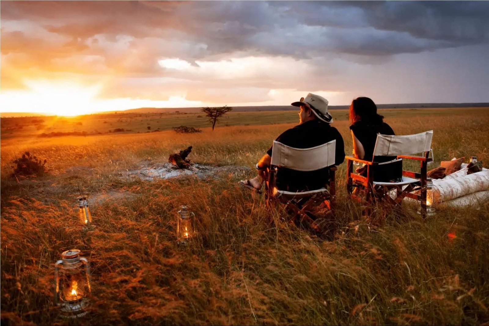 A couple watching the sunset over the plains