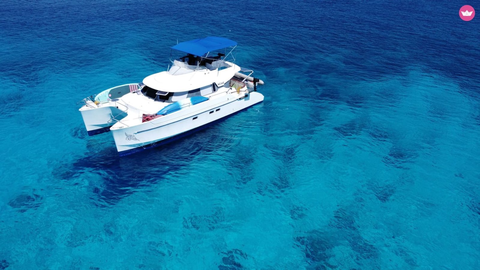 Private yacht charter through the remote outer atolls — whale sharks and deserted coral islands