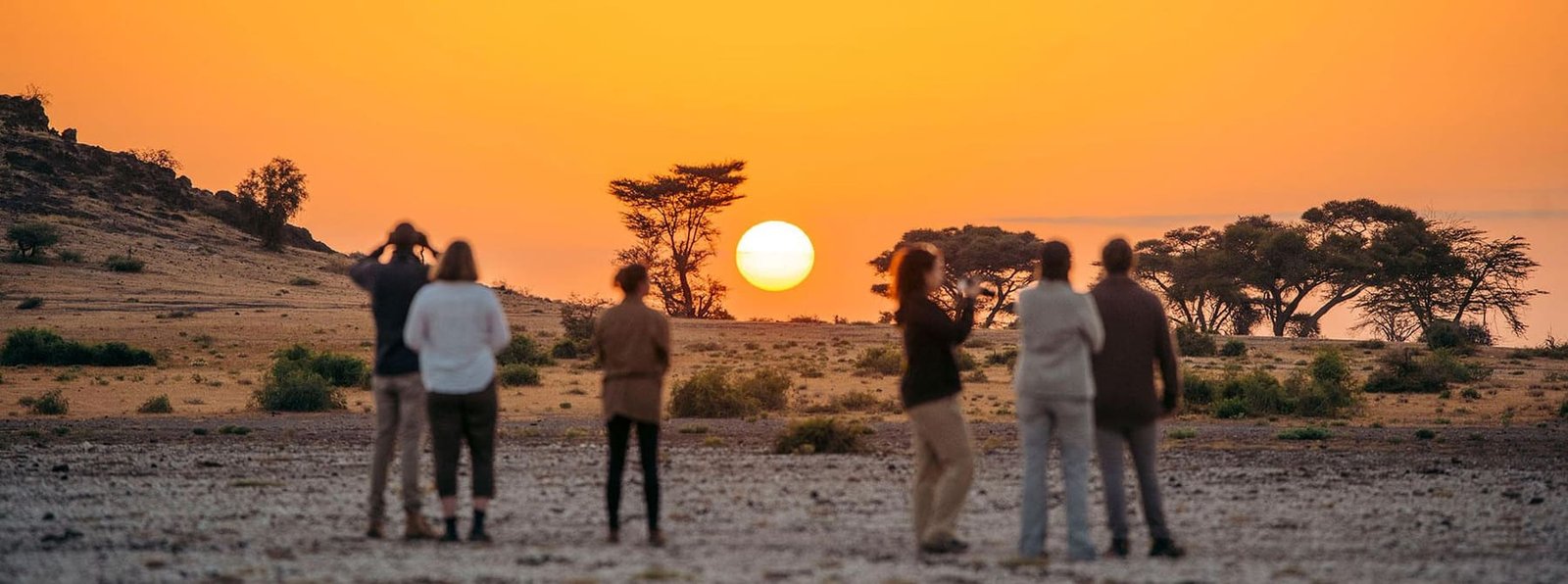 A small group gathered together on safari